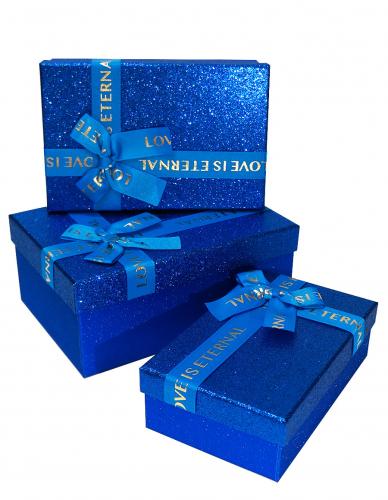 Набор из трёх синих прямоугольных подарочных коробок с бантом из ленты, отделка фактурной блестящей бумагой, размер 23*16*9,5 см.