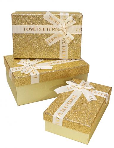 Набор из трёх золотых прямоугольных подарочных коробок с бантом из ленты, отделка фактурной блестящей бумагой, размер 23*16*9,5 см.